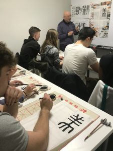 Students learning calligraphy in Shanghai.